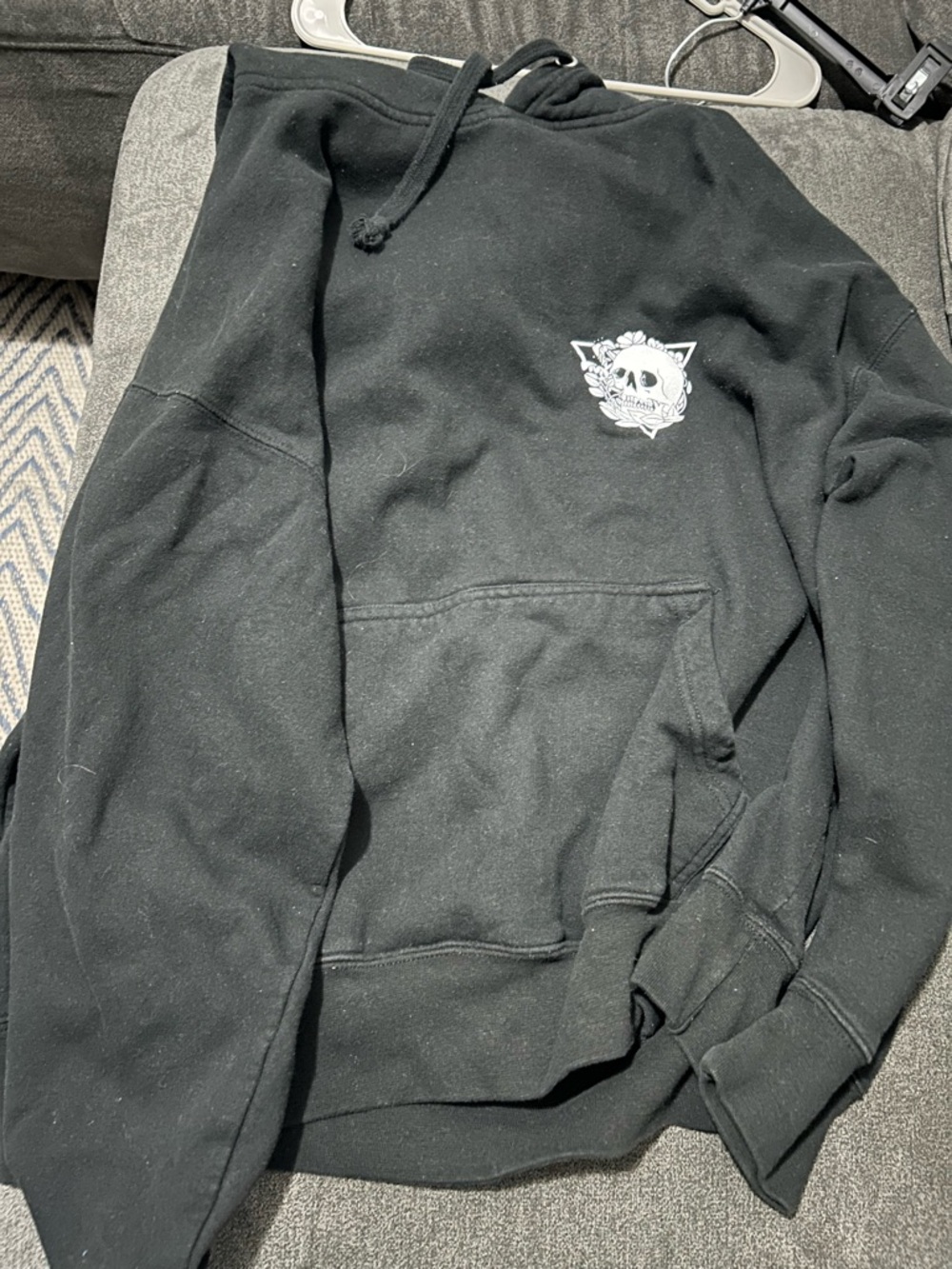 Black Hoodie with Small White Skull Graphic